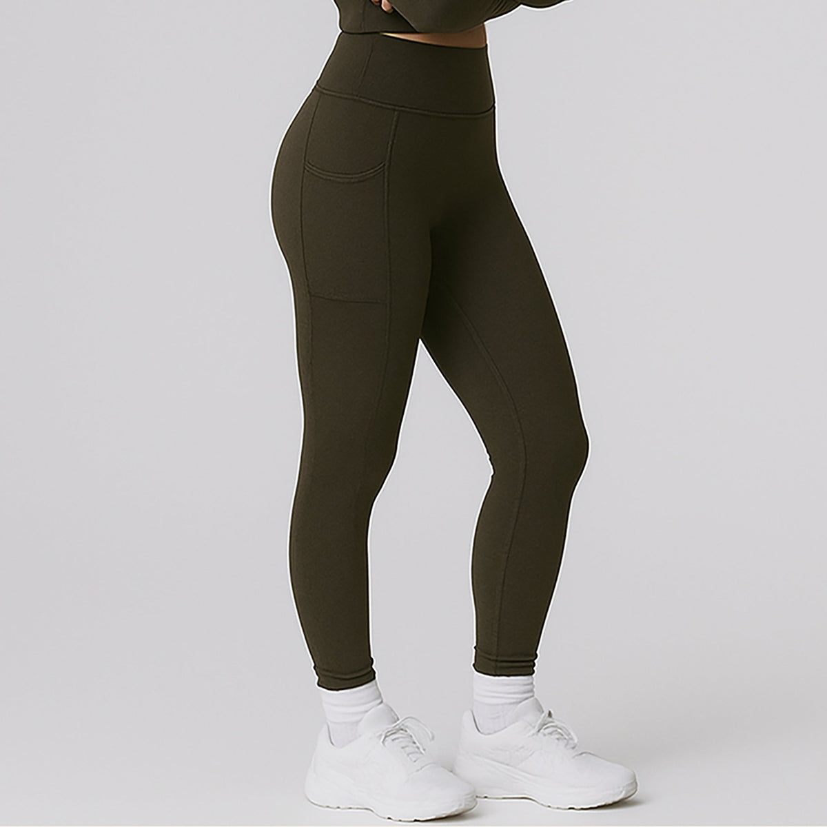 OTL high-waist pocket leggings, side view showing the pocket