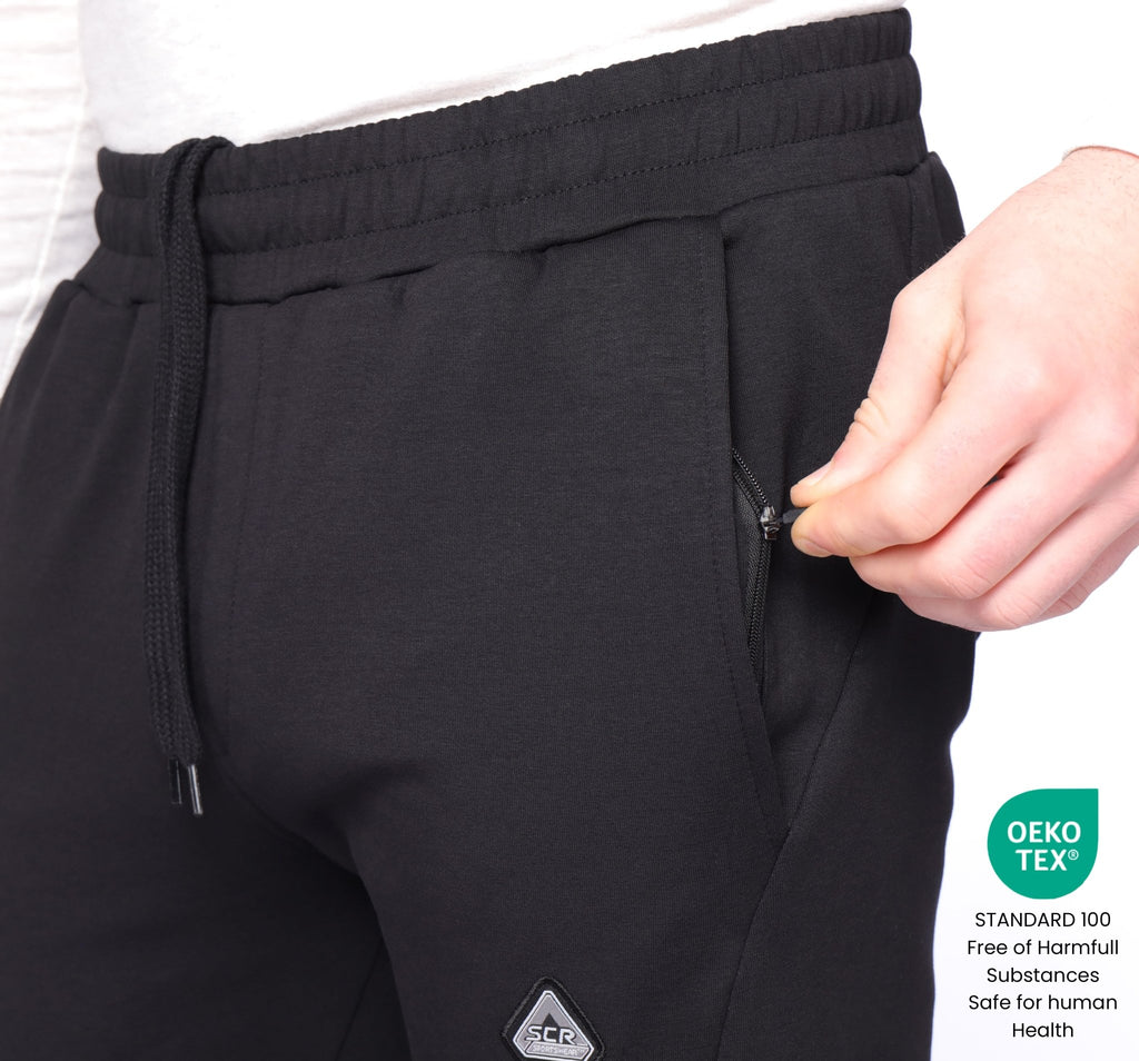 Drawstring waist and zip side pocket on black SCR Classic sweatpants